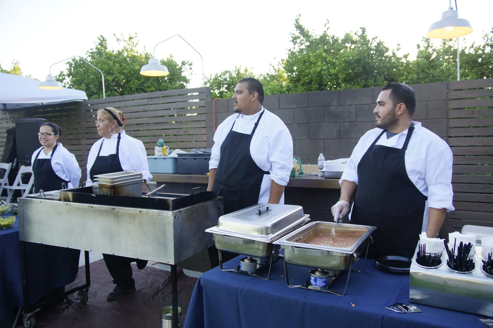 GoodFellas catering staff behind a serving station
