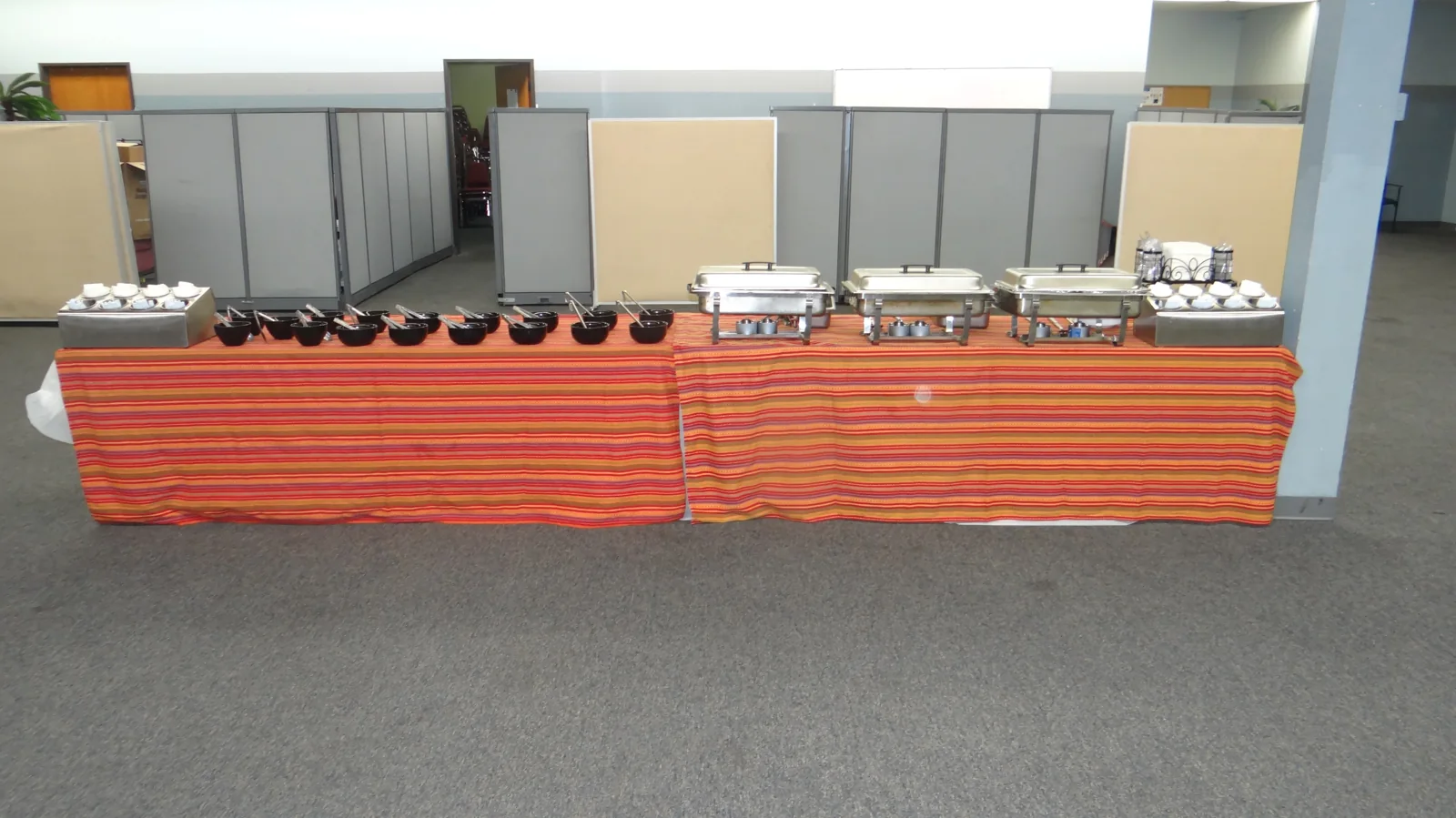 A taco buffet arranged indoors for a corporate event