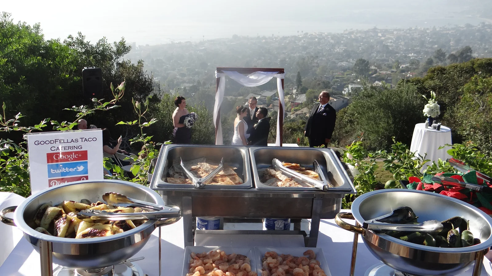 An outdoor catering station with a view of Los Angeles